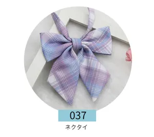Detailed view of purple blue plaid JK uniform bow tie, Japanese sailor collar accessory.
