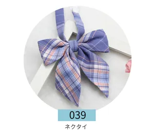 Detailed shot of Japanese JK uniform plaid bow tie, blue and pink pattern, fabric material.