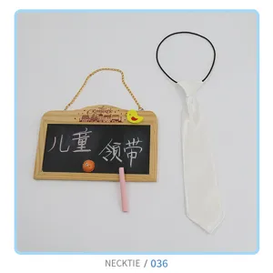 White kids necktie featuring a convenient elastic band, cute formal accessory detail view.