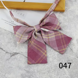 Detailed shot of Japanese JK uniform purple plaid bow tie, school uniform ribbon accessory.