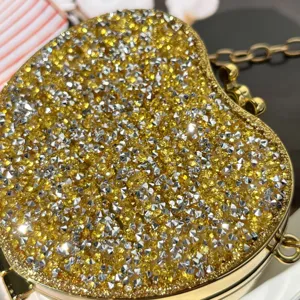 Glitzernde Mini Abendtasche in Herzform mit funkelnden Strasssteinen und goldener Kette.