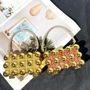 Luxury crystal evening bag for women, sparkling rhinestone beaded clutch with metal balls.