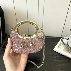 Glitzernde Strass Schultertasche mit goldenem runden Griff und Kette fuer Damen Detailansicht.