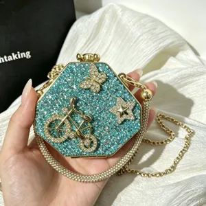 Exquisite crystal rhinestone hexagonal evening clutch bag featuring bicycle design.