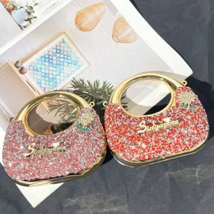 Elegante Strass Handtasche mit rundem Griff, glitzernde Abendtasche in trendigen Farben.