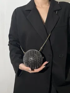 Stunning crystal ball evening bag with chic chain strap, perfect for party and wedding events.