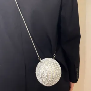 Stunning crystal rhinestone ball evening bag with elegant chain strap, perfect party clutch.