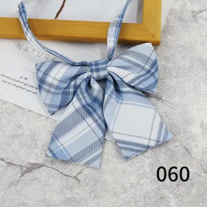 Close-up of blue plaid JK bow tie detail, sweet Japanese school style ribbon accessory.