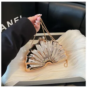 Detailed view of a stylish metallic shell acrylic evening clutch bag with chain strap for women.