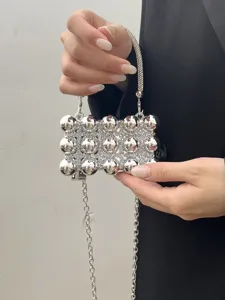 Silver rhinestone evening bag with metal spheres and chain strap for women chic party.