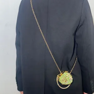 Green crystal novelty minaudiere evening bag with gold chain strap for women parties.