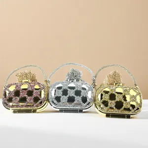 Close-up detail shot of sparkling crystal evening clutch mini bags, exquisite rhinestone texture.