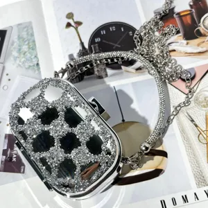 Silver rhinestone mini acrylic clutch evening bag with stylish metal chain strap for women.