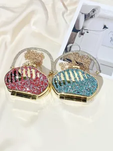 Luxury crystal rhinestone mini clutch bag with gold chain, sparkling evening party bag.