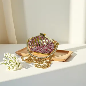 Exquisite rhinestone evening clutch bag with gold chain strap and sparkling crystals.