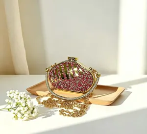 Luxury rhinestone mini box bag detail, sparkling crystals, elegant gold chain evening clutch.