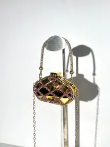 Acrylic rhinestone mini evening clutch bag detail view with metallic chain strap and lock.
