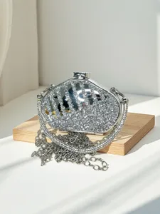 Elegant silver rhinestone mini crossbody bag with metal chain strap and clasp closure.