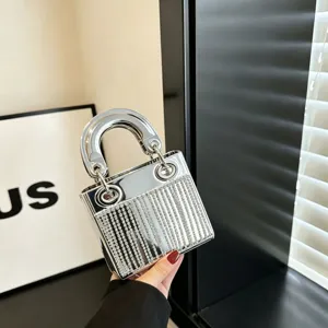 Silver mirror acrylic evening handbag with sparkling rhinestone mini party bag details and hardware.