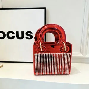 Red glossy acrylic handbag with sparkling rhinestone fringe, elegant mini party evening purse.