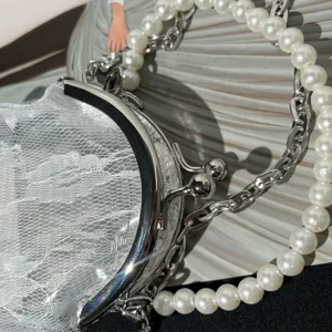 Pearl handle kiss-lock lace handbag detail shot, vintage style women coin purse and mini bag.
