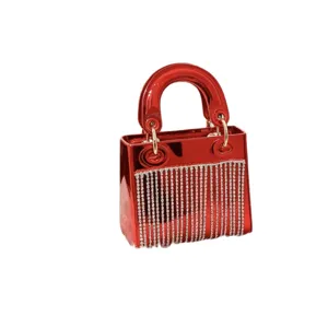 Red acrylic evening handbag featuring rhinestone fringe, glossy mini party top handle bag.