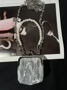Retro clear lace kiss-lock coin purse with pearl handle and metal chain crossbody bag.
