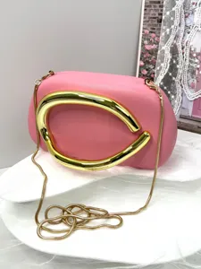 2025 chic pink evening clutch bag with bold gold metal handle and luxury chain strap for women.