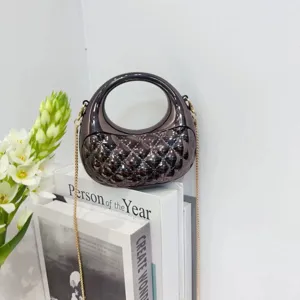 Metallic quilted mini shoulder bag with ring handle and elegant chain strap for women.