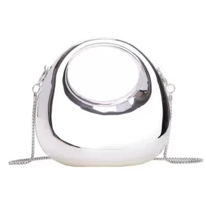 Silberne metallische hohle Kreis Handtasche stylische Acryl Umhängetasche für Damen Mode.