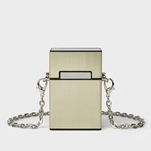 Elegant metallic gold hard case crossbody bag with silver chain strap for women.