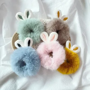 Fluffy bunny ear hair scrunchies close-up, soft plush hair ties in multiple sweet colors.