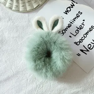 Fluffy green hair scrunchie with cute rabbit ears, soft plush hair accessory for daily wear.
