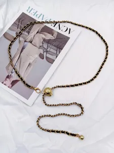 Stylish metal and leather interwoven waist chain for women, trendy accessory for dresses.