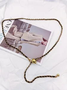 Women fashion metal waist chain, woven leather chain belt with sliding ball clasp detail.