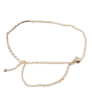 Gold metal and white leather interwoven women's waist chain belt stylish accessory main view.