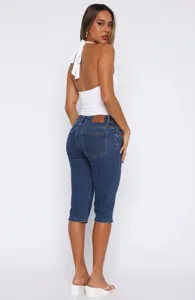 Women stretch denim capri jeans with slit hem, casual slim fit summer pants for daily wear.