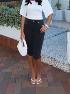 Women's stretch denim capri pants with stylish split hem design, perfect casual summer wear.
