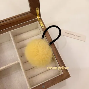 Yellow fuzzy pom pom hair tie high elasticity plush rubber band ponytail hair accessory detail