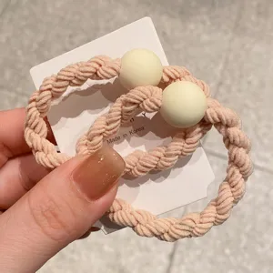 Korean minimalist braided hair scrunchie with round bead, cute pink detail view.