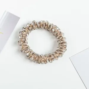 Crystal beaded hair scrunchie and bracelet 2-in-1 accessory, sparkling multi-cut bead design.