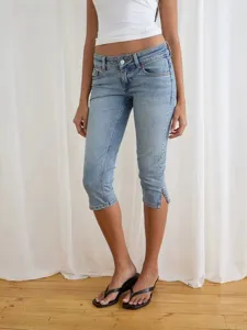 Women's stretch light wash cropped denim jeans with hem slit, casual low rise capri pants.