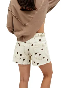 Women's polka dot denim shorts with eyelet and drawstring design for casual summer wear