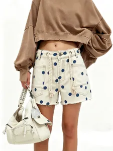 Women high rise polka dot denim shorts with drawstring and raw hem casual summer bottom