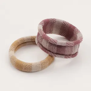 Detailed view of soft plaid towel hair ties, elastic scrunchies for women and girls daily wear.