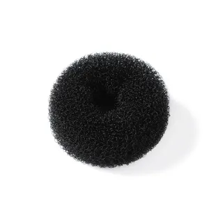 Close-up detail of black mesh hair donut bun maker for simple hair styling and elegant looks.