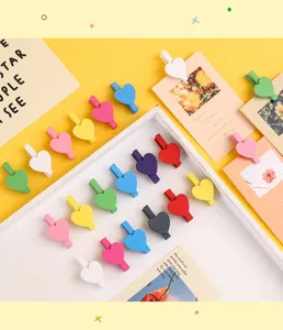 Colorful heart wooden clips for photo wall hanging, memo notes and DIY craft decoration.