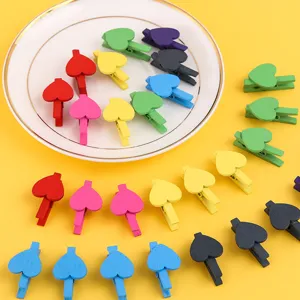 Colorful wooden heart clips set on plate main view, perfect for photo hanging and daily decor.
