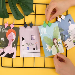 Cute wooden heart clips for photos, colorful mini memo clothespins for wall decoration.