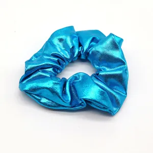 Vibrant blue metallic scrunchie detail view, glossy hair accessory for daily styling.